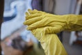 Man washing window in protective gloves closeup. Cleaning of apartments concept.