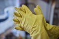 Man washing window in protective gloves closeup. Cleaning of apartments concept.