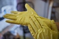 Man washing window in protective gloves closeup. Cleaning of apartments concept.