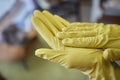 Man washing window in protective gloves closeup. Cleaning of apartments concept.