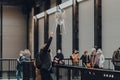 Man watches aerobes of Anicka Yi`s installation In Love With The World in Turbine Hall of Tate Modern, London, UK Royalty Free Stock Photo