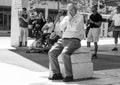 Man Watches Crowd of Anti-Trump Protestors in Downtown Columbus Ohio.