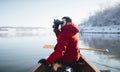 Man watching birds from a canoe Royalty Free Stock Photo