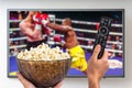 Man is watching boxing match on TV Royalty Free Stock Photo