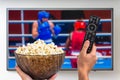 Man is watching boxing match on TV Royalty Free Stock Photo