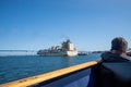 Man watching a Dole cargo ship heading towards the Coronado bridge