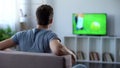 Man watching football match on big screen at home cheering his favorite team Royalty Free Stock Photo
