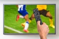 Man is watching football match on TV Royalty Free Stock Photo