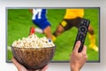 Man is watching football match on TV Royalty Free Stock Photo