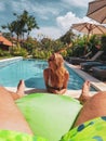 Man is watching girl in the pool