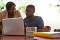Man watching on laptop and talking with woman Royalty Free Stock Photo