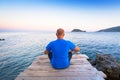 Man watching sunset over ionian sea Royalty Free Stock Photo