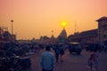 Man watching the sunset over Shree Jagannath Temple in Puri