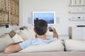 Man Watching Television In Living Room