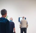 Man watching television in museum room.