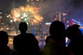 Man watching the 4th of July fireworks over water Royalty Free Stock Photo