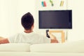 Man watching tv and changing channels at home Royalty Free Stock Photo