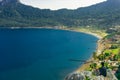 A man watching the view of Marmaris bay. Amazing landscape with mountain, beach and bay detail. Kumlubuk, Marmaris, Turkey.