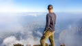 A man watching the volcanic landscape in front of him