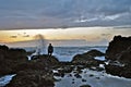 Man Watching Waves Crash at Sunset Royalty Free Stock Photo