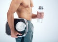 Man, water bottle or scale for body fitness, workout or training progress in healthcare wellness, diet control or muscle Royalty Free Stock Photo