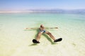 A man on the water of the dead sea in Israel Royalty Free Stock Photo