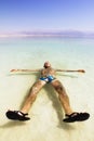 A man on the water of the dead sea in Israel Royalty Free Stock Photo