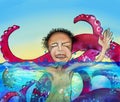 Man in water with monster Royalty Free Stock Photo