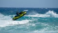 Man on water scooter, Jet ski against sea waves Royalty Free Stock Photo