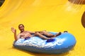 Man on water slide Royalty Free Stock Photo