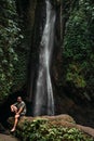 A man at the waterfall. A person travels around the world. The man at the waterfall. Travel to Bali, Indonesia.
