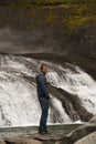 Man at a waterfall Royalty Free Stock Photo
