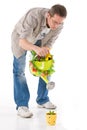 Man watering small plant