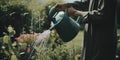 A man is watering water from a green watering can. Generative AI image.