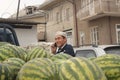 Man and watermelons Royalty Free Stock Photo