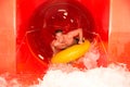 Man in waterslide at public swimming pool Royalty Free Stock Photo