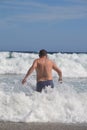 Man in the waves Royalty Free Stock Photo