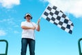 Man waving a checkered flag on a raceway Royalty Free Stock Photo