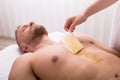 Man Waxing Chest In Spa Royalty Free Stock Photo