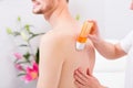 Man at waxing hair removal in beauty parlor Royalty Free Stock Photo