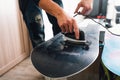 Man is waxing a snowboard