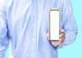 Man wear blue shirt hand hold mockup shiny aluminum can isolated on Blue background Royalty Free Stock Photo