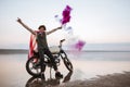 Man wearing american cape holding smoke bomb Royalty Free Stock Photo