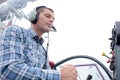 man wearing aviation headset by control panel Royalty Free Stock Photo