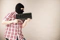 Man wearing balaclava holding keyboard Royalty Free Stock Photo