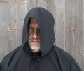 Man Wearing a Black Hooded Cape One Eye