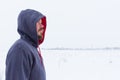 Man wearing blank grey hoodie, in the urban background near the river Royalty Free Stock Photo