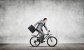 Man wearing business suit riding bicycle outdoor. Royalty Free Stock Photo