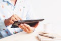 Man wearing casual shirt using tablet. Smart life concept Royalty Free Stock Photo