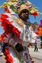 Man Wearing Colorful Costume Walks In Parade Celebrating Caribbean Culture Royalty Free Stock Photo